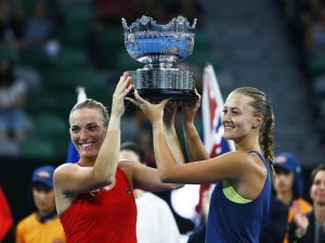 Tennis - Australian Open - Women's Doubles Final - Rod Laver Arena, Melbourne, Australia, January 26, 2018. Hungary's Timea Babos and France's Kristina Mladenovic celebrate winning the Women's Doubles Final with the trophy after winning their match against Russia's Ekaterina Makarova and Elena Vesnina. REUTERS/Edgar Su